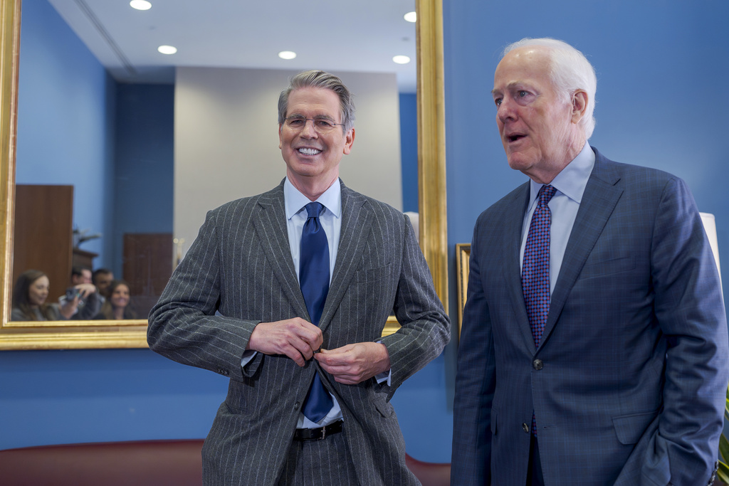 Scott Bessent, left, President-elect Donald Trump's nominee to be Treasury secretary, meets with Sen. John Cornyn, R-Texas, a member of the Senate Finance Committee which will preside over Bessent's confirmation, at the Capitol in Washington, Tuesday, Jan. 7, 2025. (AP Photo/J. Scott Applewhite)