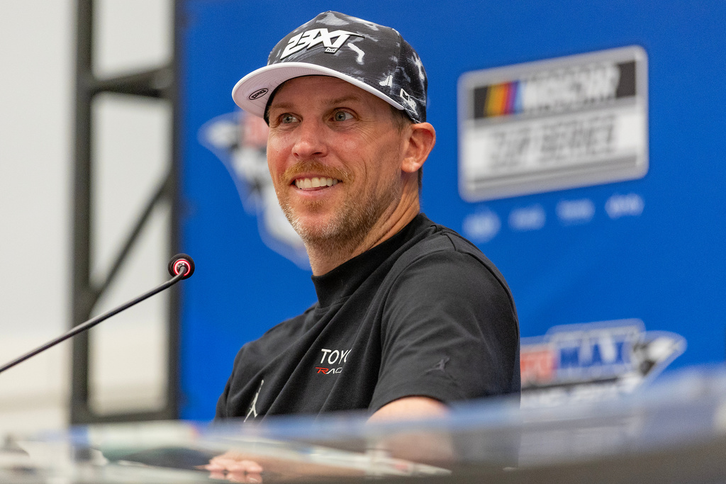 23XI Racing's team co-owner Denny Hamlin speaks to media follow a win by his driver Tyler Reddick during a NASCAR Cup Series auto race in Austin, Texas, Sunday, March 1, 2026. (AP Photo/Stephen Spillman)