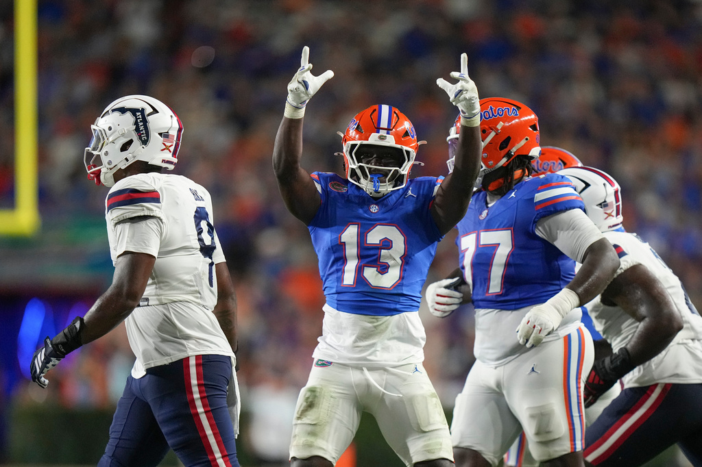 FILE - Florida Gators running back Jadan Baugh (13) celebrates after rushing for a first down during an NCAA college football game against the Florida Atlantic Owls in Gainesville, Fla., Sept. 5, 2026. (AP Photo/Peter Joneliet, File)