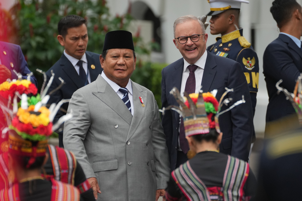 Australian Prime Minister Anthony Albanese, right, is greeted by Indonesian President Prabowo Subianto upon arrival for their meeting at Merdeka Palace in Jakarta, Indonesia, Friday, Feb. 6, 2026. (AP Photo/Achmad Ibrahim)