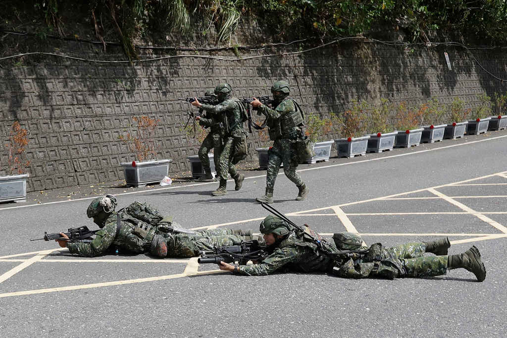 Soldiers participate in the annual Han Kuang military exercises in Yilan, northeastern Taiwan, Monday, Aug. 10, 2026. (AP Photo/Chiang Ying-ying, Pool)