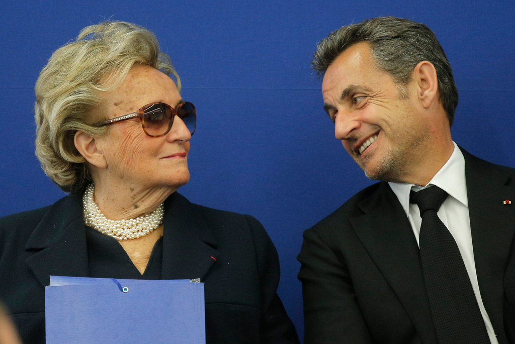 FILE - Former French President Nicolas Sarkozy speaks with former first lady Bernadette Chirac during the inauguration of the Foundation Claude Pompidou, Centre teaching and research on Alzheimer's disease, Monday, March 10, 2014, in Nice, southeastern France. (AP Photo/Lionel Cironneau, File)