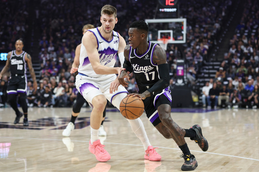 Sacramento Kings guard Dennis Schröder (17) drives to the basket with Utah Jazz center Kyle Filipowski, left, defending during the first half of an NBA basketball game Friday, Oct. 24, 2025, in Sacramento, Calif. (AP Photo/Sara Nevis) Sacramento Kings guard Dennis Schröder (17) drives to the basket with Utah Jazz center Kyle Filipowski, left, defending during the first half of an NBA basketball game Friday, Oct. 24, 2025, in Sacramento, Calif. (AP Photo/Sara Nevis)