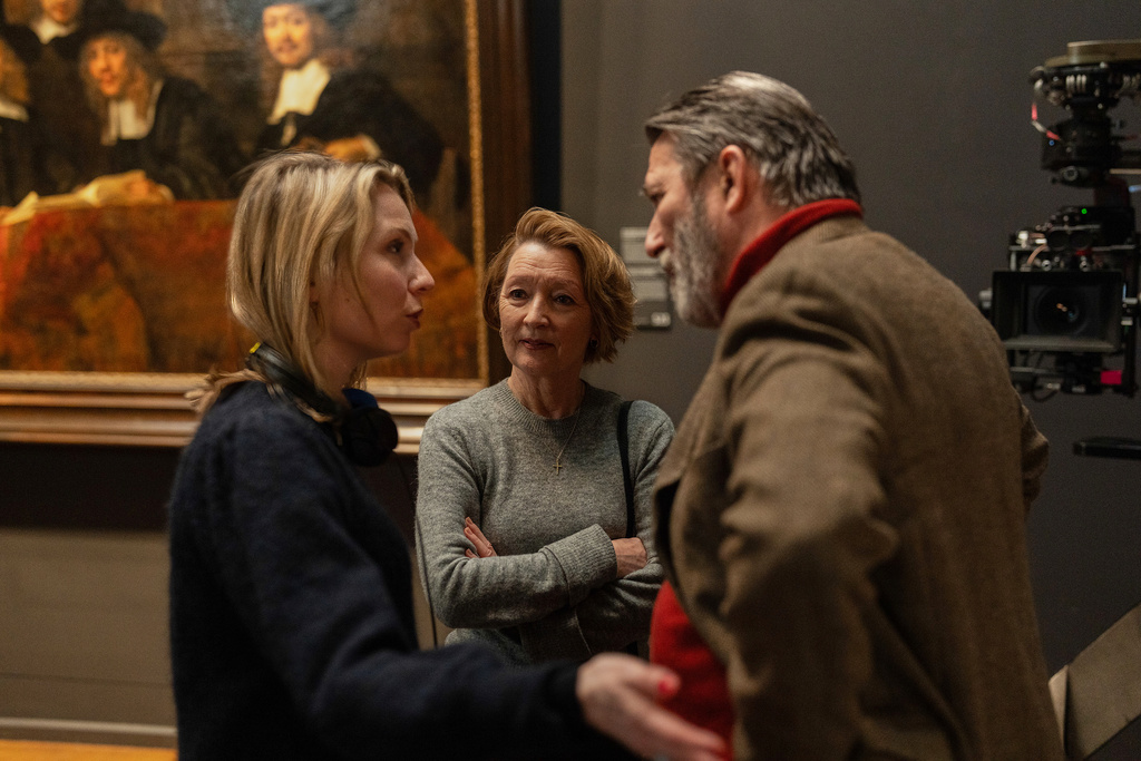 This image released by Focus Features shows director Polly Findlay, left, with actors Ciarán Hinds, right, and Lesley Manville during the filming of "Midwinter Break." (Mark de Blok/Focus Features via AP)