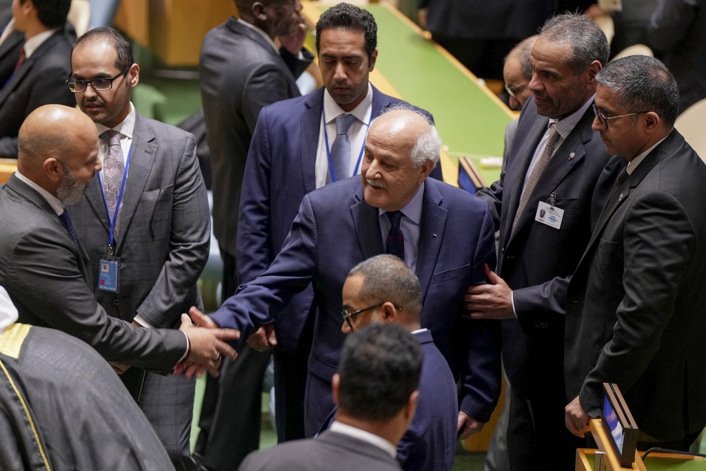 CORRECTS ID: Palestinian ambassador to the U.N. Riyad Mansour arrives inside the General Assembly Hall, Monday, Sept. 22, 2025, at UN headquarters. (AP Photo/Angelina Katsanis)