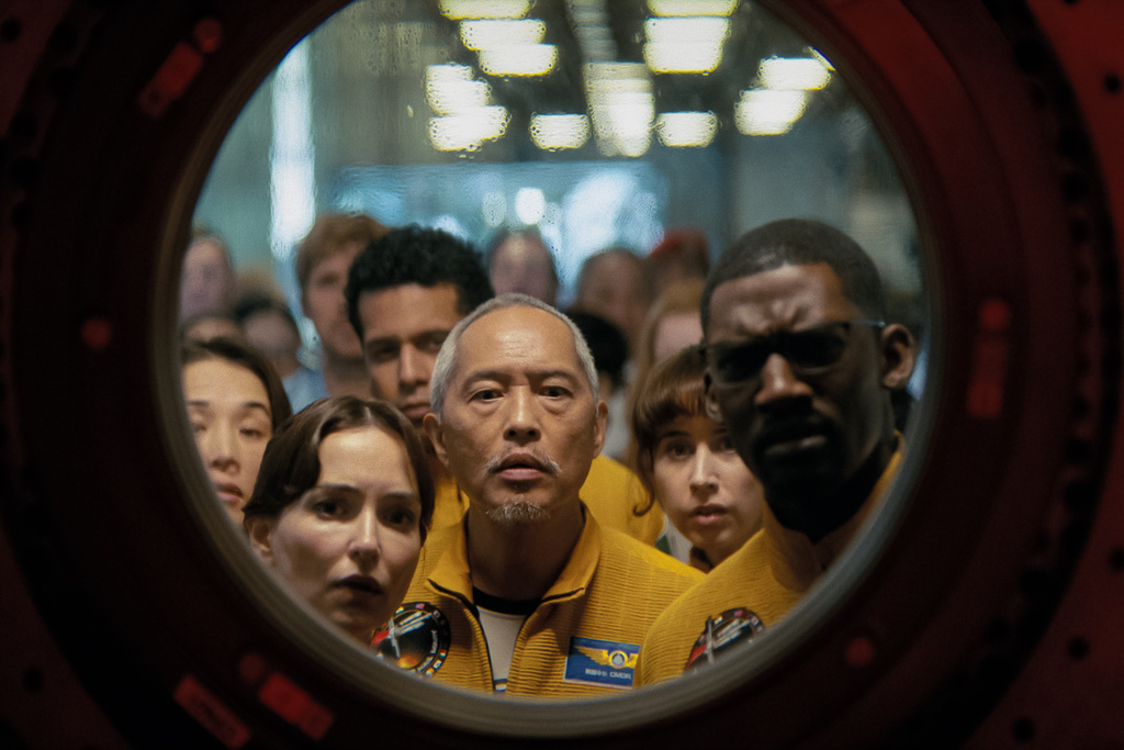 This image released by Amazon MGM Studios shows Ken Leung, center, in a scene from "Project Hail Mary." (Amazon MGM Studios via AP)