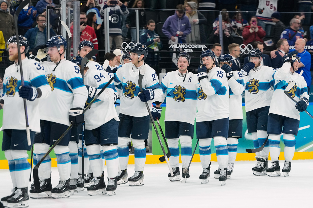 The Finland team celebrate their win in a men's ice hockey bronze medal game between Slovakia and Finland at the 2026 Winter Olympics, in Milan, Italy, Saturday, Feb. 21, 2026. (AP Photo/Petr David Josek)