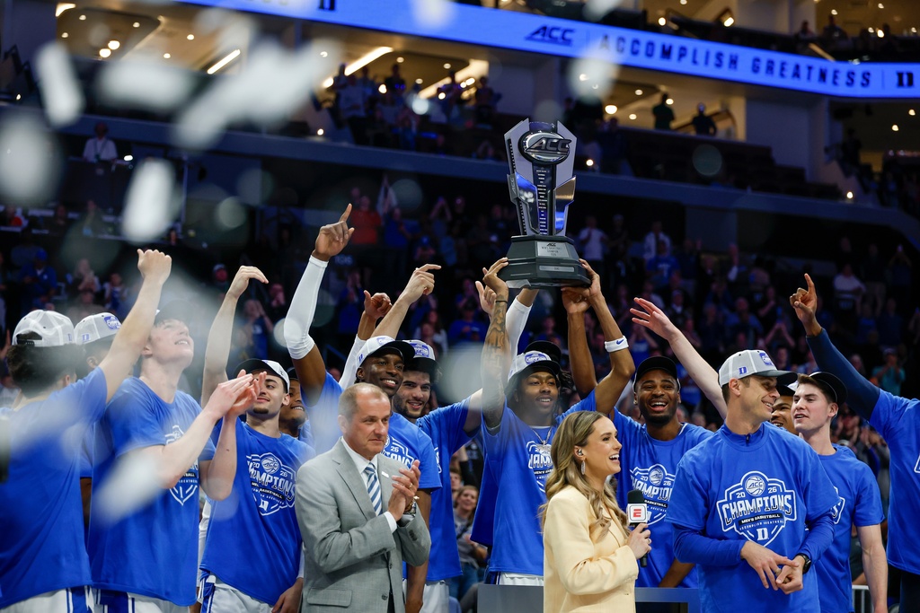 Duke celebrates winning the championship of the Atlantic Coast Conference tournament in an NCAA college basketball game in Charlotte, N.C., Saturday, March 14, 2026. (AP Photo/Nell Redmond)