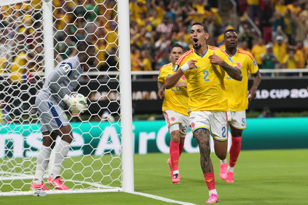 Colombia's Daniel Munoz (2) celebrates after scoring his side's opening goal during the World Cup Group K soccer match between Colombia and Congo in Zapopan, near Guadalajara, Mexico, Tuesday, June 23, 2026. (AP Photo/Fernando Llano)
