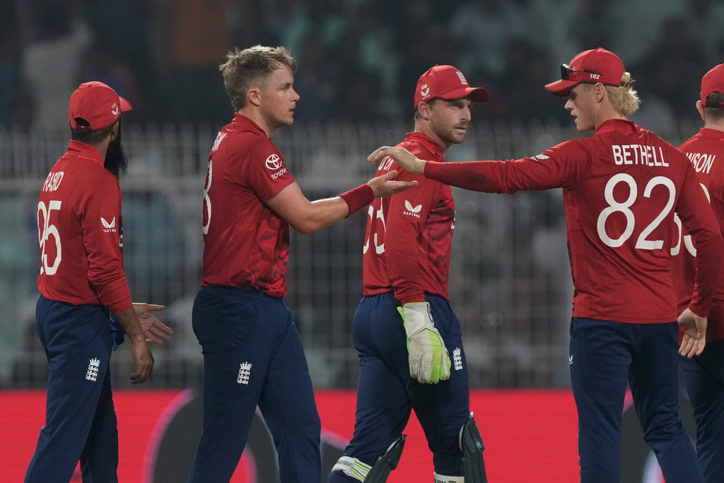 England's Sam Curran, second from left, celebrates with teammates the wicket of Italy's Grant Stewart during the T20 World Cup cricket match between England and Italy in Kolkata, India, Monday, Feb. 16, 2026. (AP Photo/Bikas Das)
