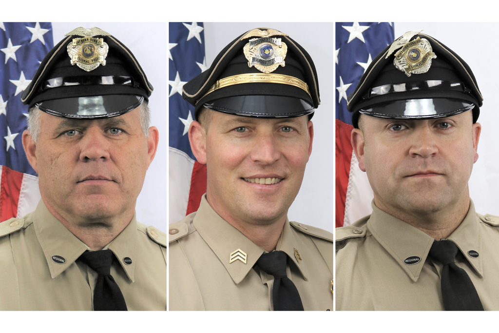 This combo of images provided by the York County, Pa., District Attorney's office on Thursday, Sept. 18, 2025, shows, from left, Det. Mark Baker, Det. Sgt. Cody Becker and Det. Isaiah Emenheiser, all of the Northern York County Regional Police Department. (Northern York County Regional Police Department/York County District Attorney's Office via AP)