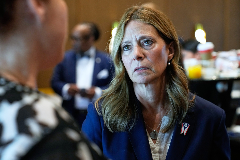 FILE - Amy Acton, Democratic candidate for Ohio governor, talks with people during a break in a conference in Columbus, Ohio, April 15, 2026. (AP Photo/Sue Ogrocki, File)