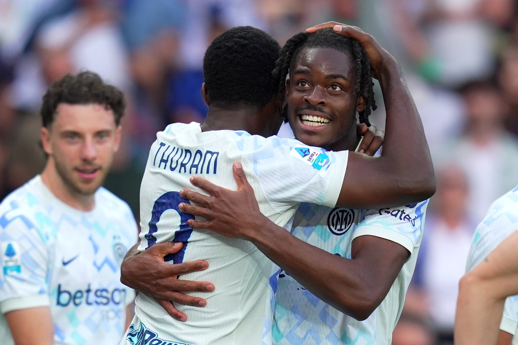 Inter Milan's Yann Aurel Bisseck, right, celebrates with teammate Marcus Thuram after scoring their sides's second goal ball during a Serie A soccer match between Torino and Inter Milan, in Turin, Italy, Sunday, April 26, 2026. (Spada/LaPresse via AP)