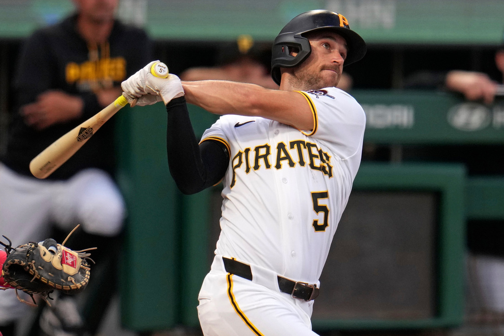 Pittsburgh Pirates' Brandon Lowe follows through on a solo home run off Washington Nationals pitcher PJ Poulin during the first inning of a baseball game in Pittsburgh, Tuesday, April 14, 2026. (AP Photo/Gene J. Puskar)