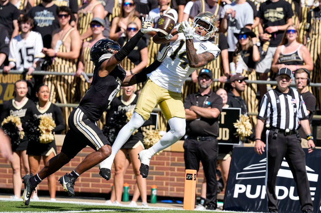 Purdue defensive back Hudauri Hines (4) breaks up a pass intended for Notre Dame wide receiver Micah Gilbert (14) during the first half of an NCAA college football game in West Lafayette, Ind., Saturday, Sept. 26, 2026. (AP Photo/Michael Conroy)