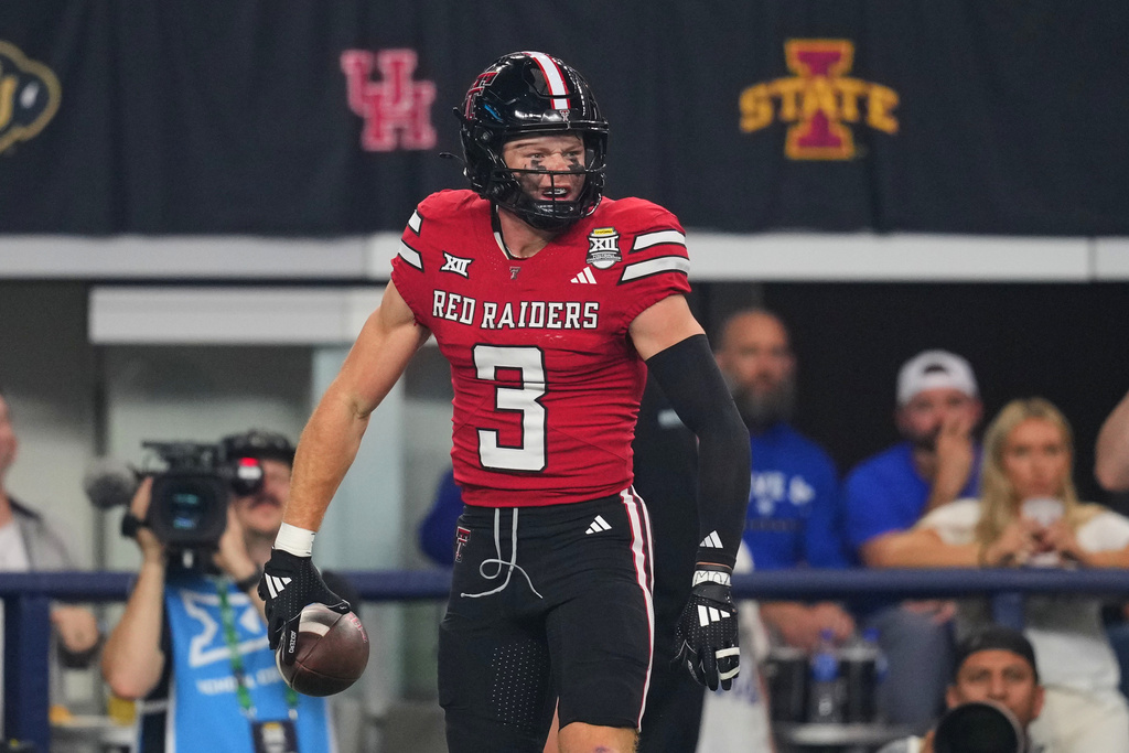 Texas Tech wide receiver Coy Eakin celebrates after catching a touchdown pass in the first half of a Big 12 Conference championship NCAA college football game against BYU Saturday, Dec. 6, 2025, in Arlington, Texas. (AP Photo/Julio Cortez)