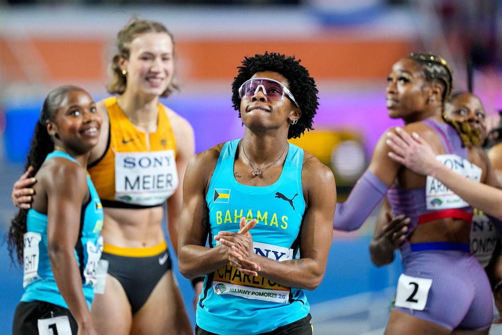Devynne Charlton, of Bahamas, reacts after crossing the finish line to win the gold medal in the women's 60 meters hurdles final at the World Athletics Indoor Championships in Torun, Poland, Sunday, March 22, 2026. (AP Photo/Petr David Josek)