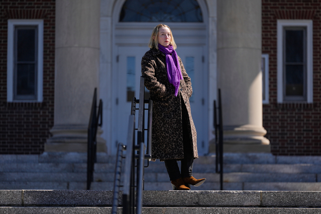 Allison Posner, an organizer for an upcoming "No Kings" protest poses for a photo on the steps of the town hall in Maplewood, N.J., Tuesday, March 24, 2026. (AP Photo/Seth Wenig)