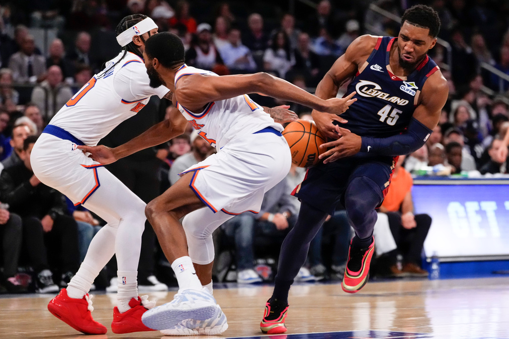 Cleveland Cavaliers guard Donovan Mitchell (45) looses control of the ball during the first half of an NBA basketball game against the New York Knicks, Thursday, Dec. 25, 2025, in New York. (AP Photo/Yuki Iwamura)