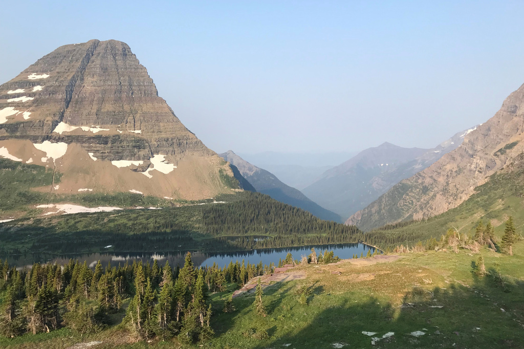 Mount Brown, second peak from left, is tucked behind Bearhat Mountain, far left, at Glacier National Park on Aug. 1, 2018, in West Glacier, Mont. (AP Photo/Desiree Brooks)