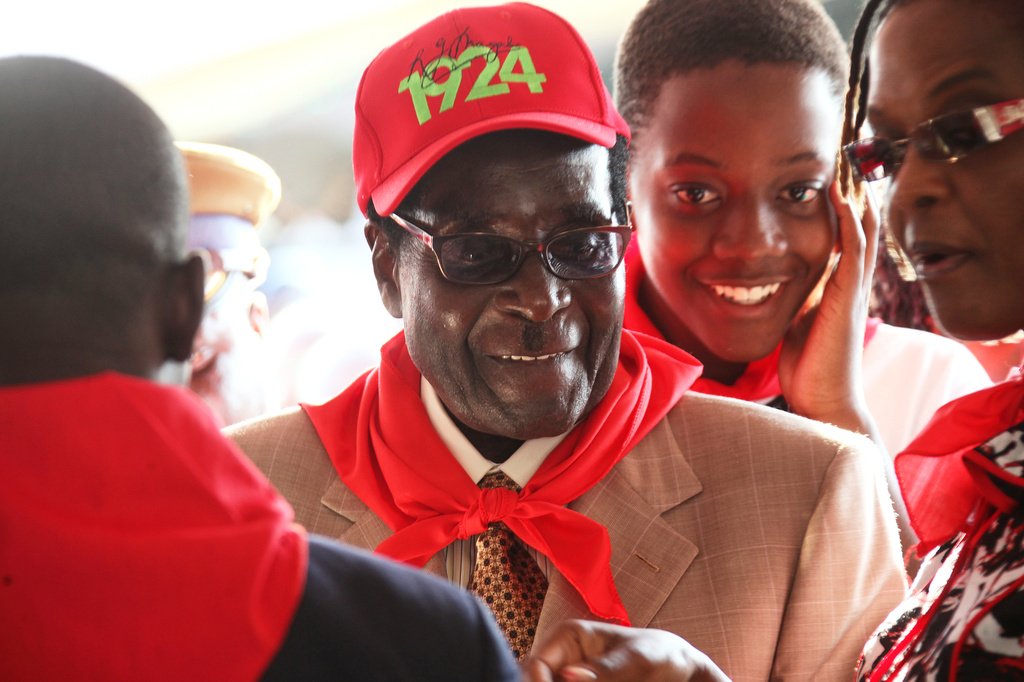 FILE - Zimbabwean President Robert Mugabe smiles during celebrations to mark his 89th birthday in Bindura about 100 kilometres north of Harare, March, 2, 2013. (AP Photo/Tsvangirayi Mukwazhi, File)