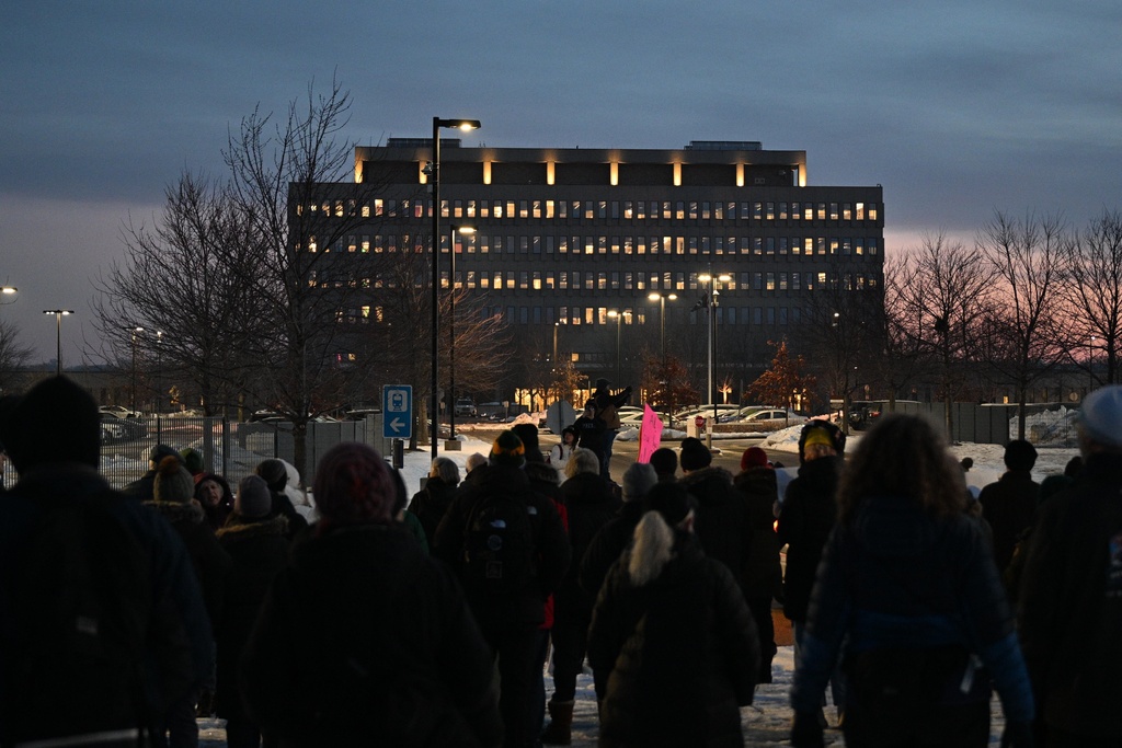 Protesters gather outside the Bishop Henry Whipple Federal Building, Thursday, Jan. 8, 2026, in Minneapolis, Minn. (AP Photo/Tom Baker)