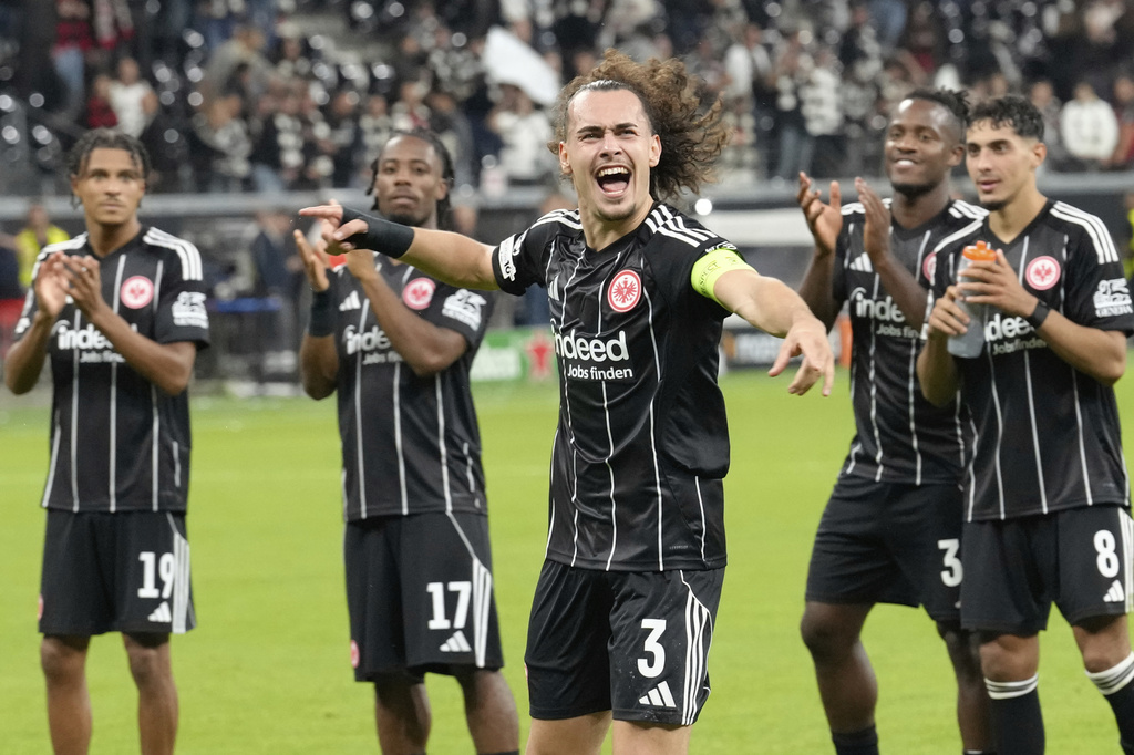 Frankfurt's Arthur Theate celebrates after winning the Champions League opening phase soccer match between Eintracht Frankfurt and Galatasaray Istanbul in Frankfurt, Germany, Thursday, Sept. 18, 2025. (AP Photo/Martin Meissner)