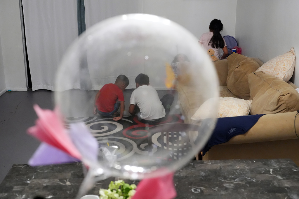 Mexican asylum-seeker Blanca's three young children play inside the family's rented duplex in Apopka, Fla., Wednesday, Aug. 20, 2025. (AP Photo/Rebecca Blackwell)
