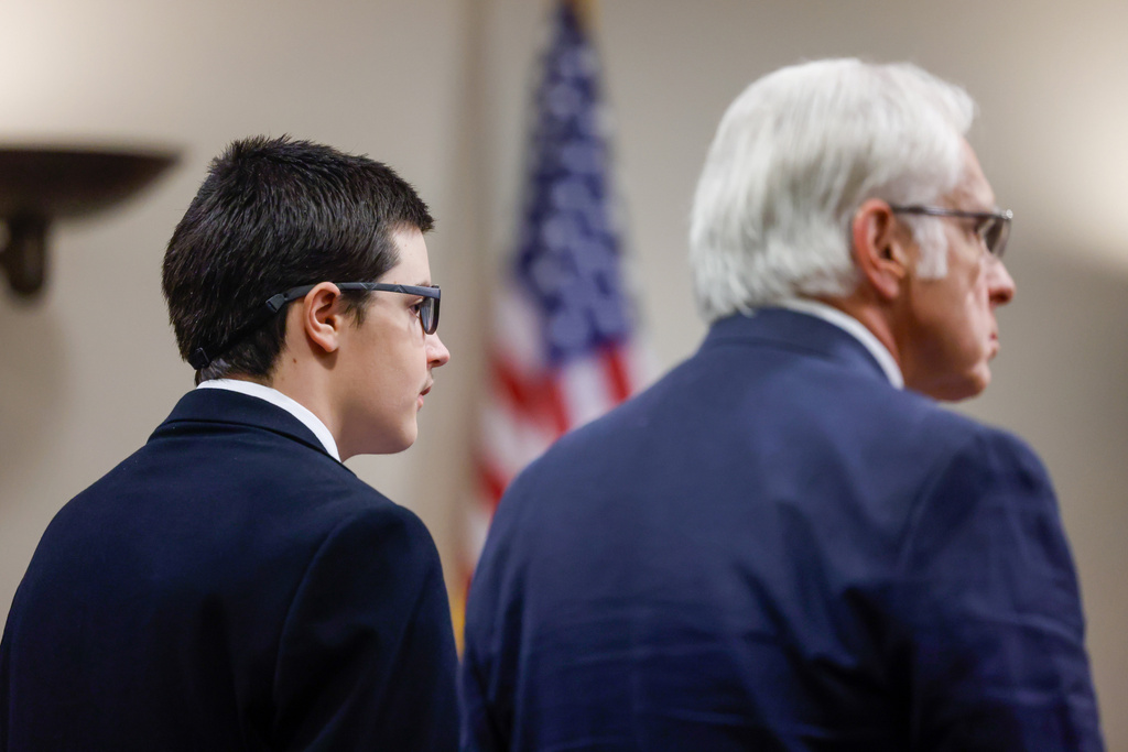 Colt Gray, left, the 16-year-old Apalachee High School shooting suspect, stands next to his attorney Charlton Allen and pleads guilty at Barrow County Superior Court in Winder, Ga., on Friday, July 24, 2026. (Arvin Temkar/Atlanta Journal-Constitution via AP)