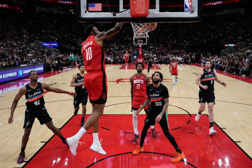 Houston Rockets forward Jabari Smith Jr. (10) dunks during the first half of an NBA basketball game against the San Antonio Spurs in Houston, Tuesday, Jan. 20, 2026. (AP Photo/Ashley Landis)