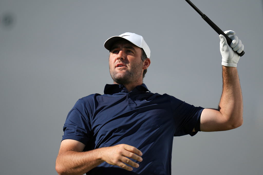 Scottie Scheffler watches his tee shot at the 17th hole during the first round of the Phoenix Open golf tournament at the TPC Scottsdale Stadium Course Thursday, Feb. 5, 2026, in Scottsdale, Ariz. (AP Photo/Ross D. Franklin)