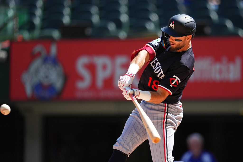 Minnesota Twins' Kody Clemens swings at a pitch from the Texas Rangers during the first inning of a baseball game Thursday, Sept. 25, 2025, in Arlington. (AP Photo/Julio Cortez)