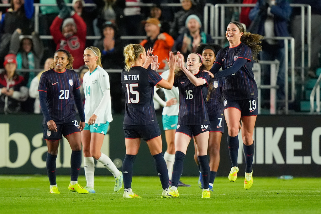 United States midfielder Rose Lavelle (16) celebrates with teammates after scoring a goal during the first half of a women's international friendly soccer match against New Zealand, Wednesday, Oct. 29, 2025, in Kansas City, Mo. (AP Photo/Charlie Riedel)