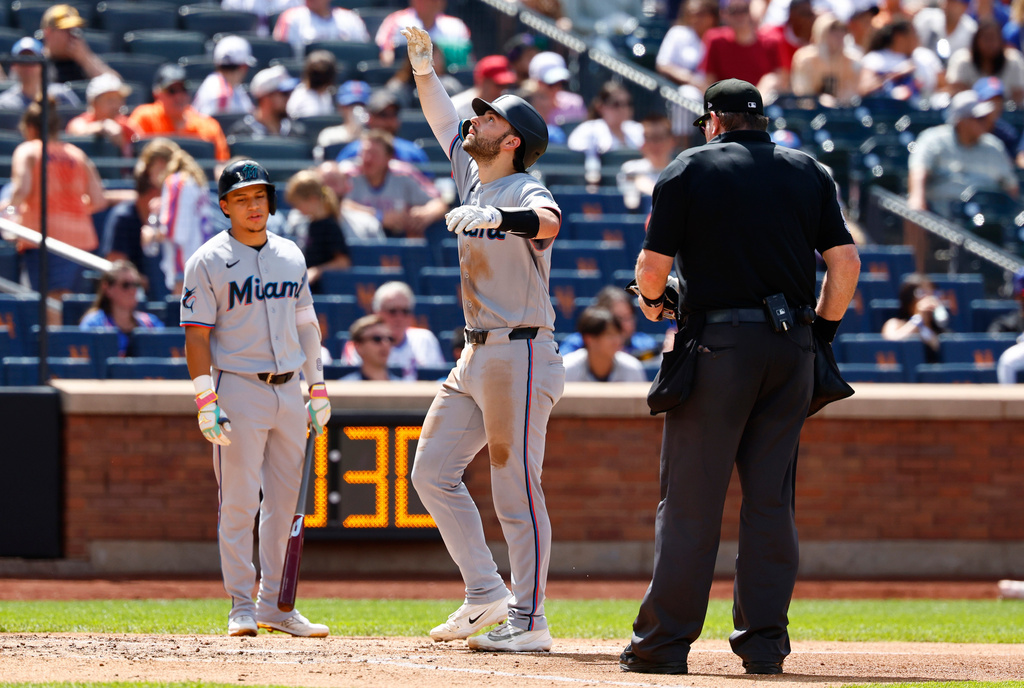 Miami Marlins' Joe Mack, center, reacts after hitting home run against the New York Mets during the fifth inning of a baseball game, Sunday, Aug. 2, 2026, in New York. (AP Photo/Noah K. Murray)