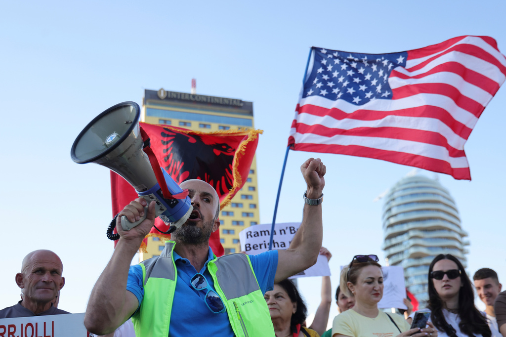 Protesters take part in a rally in Tirana, Albania, Tuesday, June 9, 2026, against the construction of a massive coastal development project linked to Jared Kushner and Ivanka Trump at Narta lagoon area, western Albania. (AP Photo/Hameraldi Agolli)