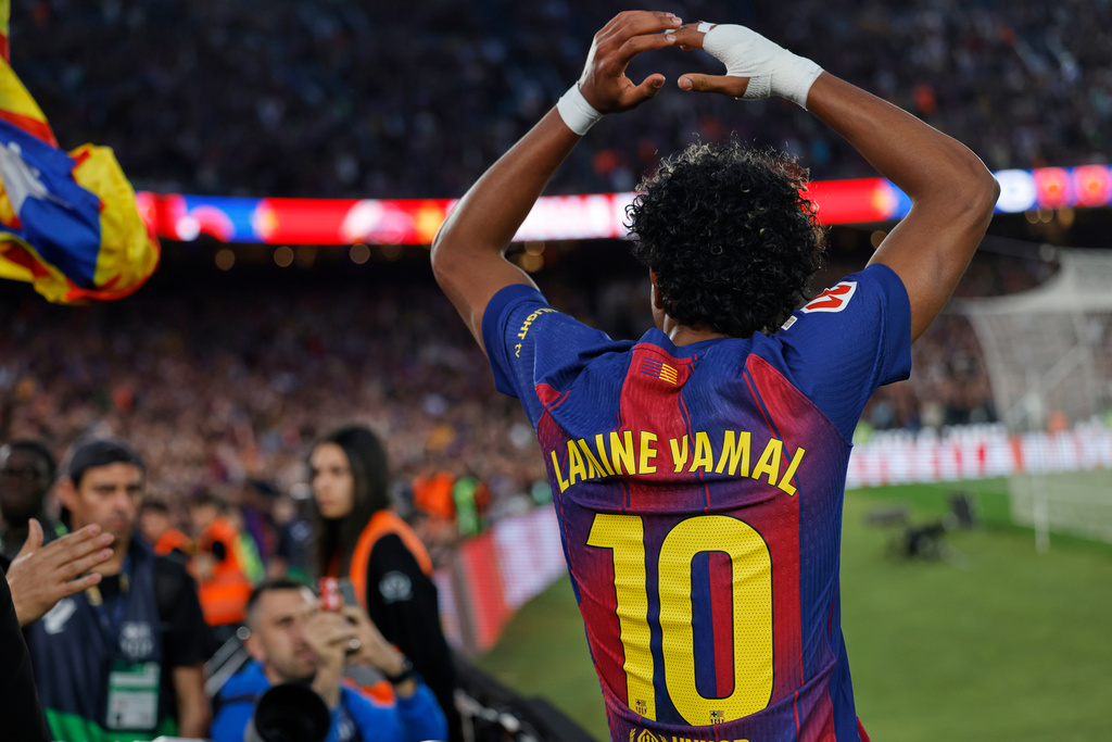 Barcelona's Lamine Yamal celebrates during the Spanish La Liga soccer match between Barcelona and Espanyol in Barcelona, Spain, Saturday, April 11, 2026. (AP Photo/Joan Monfort)