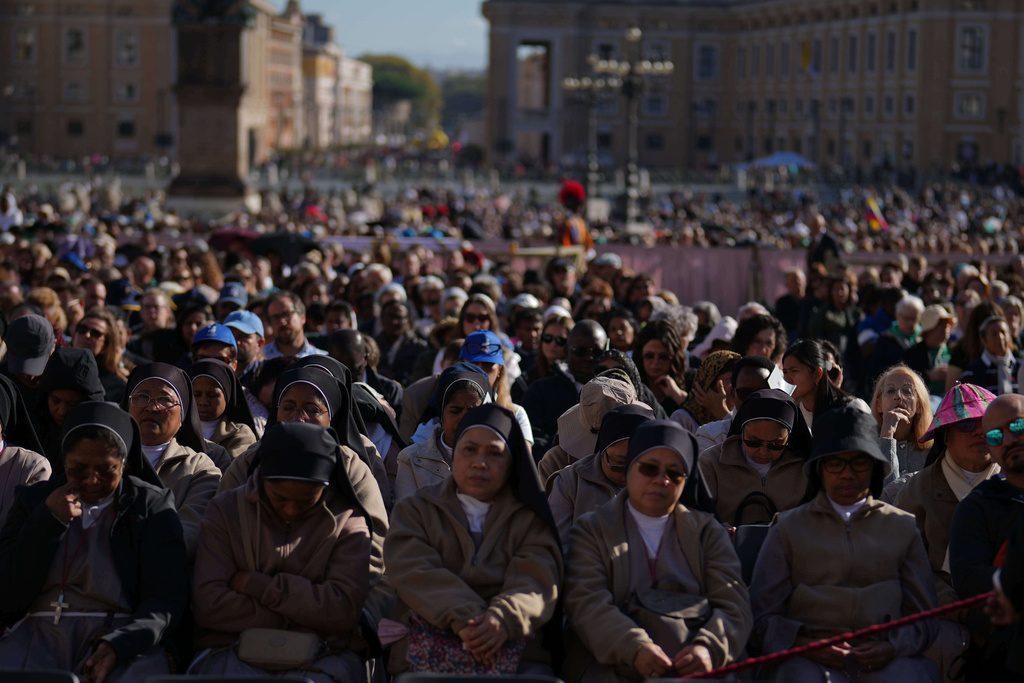 Nuns attend a Mass with Pope Leo XIV and the Jubilee of the Educational World on the Solemnity of All Saints, in St. Peter's Square, at the Vatican, Saturday, Nov. 1, 2025, during which he will proclaim St. John Henry Newman a Doctor of the Church. (AP Photo/Andrew Medichini)