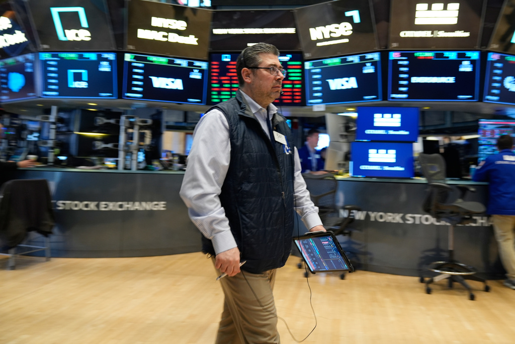 Michael Capolino works on the floor at the New York Stock Exchange in New York, Thursday, March 19, 2026. (AP Photo/Seth Wenig)