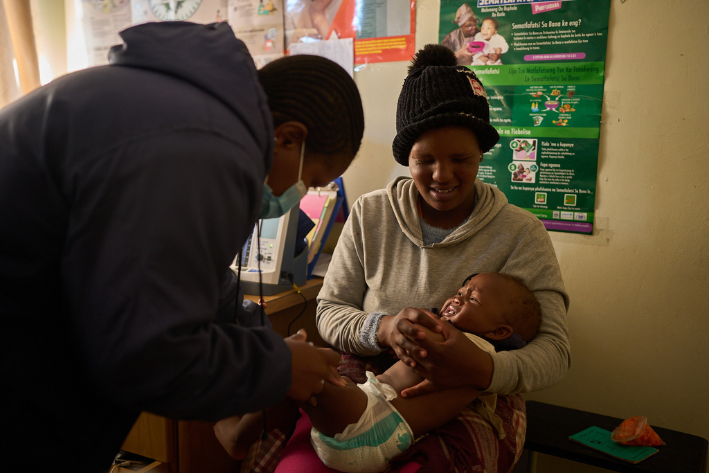 FILE - A nurse vaccinates a child at a clinic in Ha Lejone, Lesotho, July 16, 2025. (AP Photo/Bram Janssen, File)