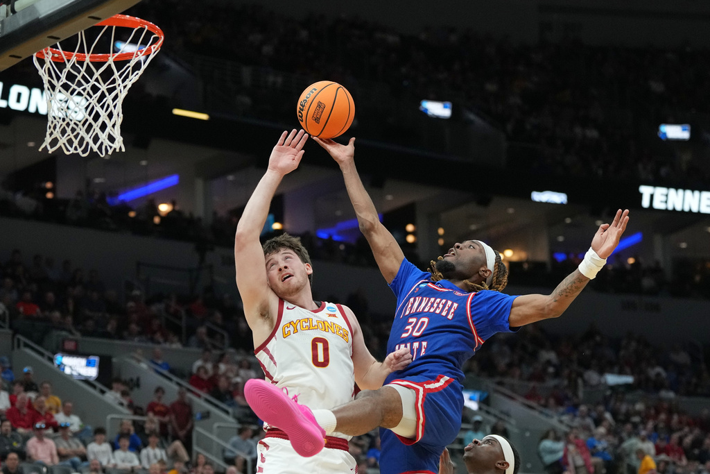 Tennessee State's Aaron Nkrumah (30) is fouled on his way to the basket by Iowa State's Nate Heise (0) during the first half in the first round of the NCAA college basketball tournament, Friday, March 20, 2026, in St. Louis. (AP Photo/Jeff Roberson)