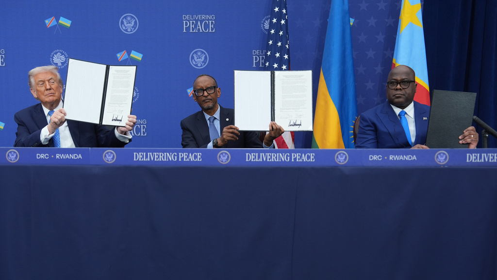 President Donald Trump, Rwanda's President Paul Kagame and Democratic Republic of Congo President Felix-Antoine Tshisekedi, during a signing ceremony at the Donald J. Trump Institute of Peace, Thursday, Dec. 4, 2025, in Washington. (AP Photo/Evan Vucci)