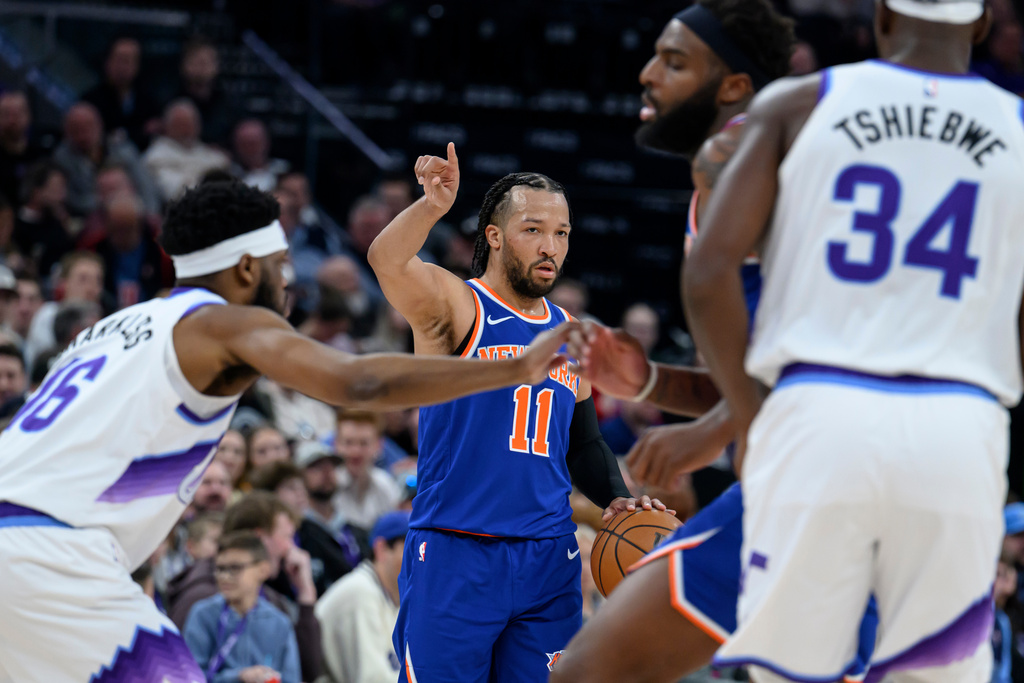 New York Knicks guard Jalen Brunson (11) sets the play during the first half of an NBA basketball game against the Utah Jazz, Wednesday, March 11, 2026, in Salt Lake City. (AP Photo/Tyler Tate)