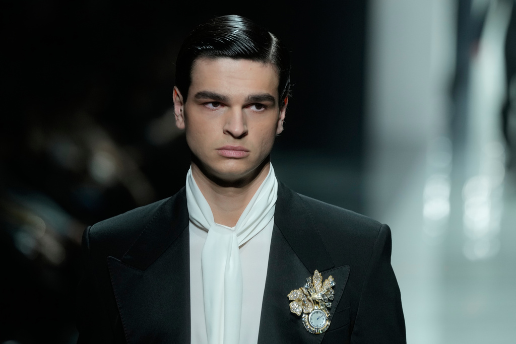 A model wears a creation as part of the Dolce & Gabbana Fall/Winter 2026-2027 Men's collection presented in Milan, Italy, Saturday, Jan. 17, 2026. (AP Photo/Luca Bruno)