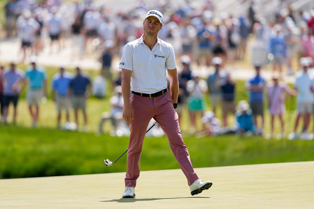 Justin Thomas reacts to missing a putt on the 17th green during the final round of the PGA Championship golf tournament at Aronimink Golf Club, Sunday, May 17, 2026, in Newtown Square, PA. (AP Photo/Carolyn Kaster)