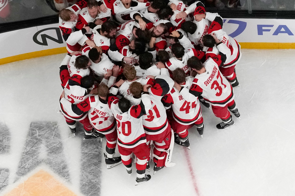 Carolina Hurricanes celebrate after defeating the Vegas Golden Knights in Game 6 of the NHL hockey Stanley Cup Final series , Sunday, June 14, 2026, in Las Vegas. (AP Photo/John Locher)