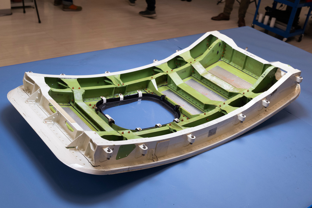 FILE - The door plug from the Alaska Airlines Flight 1282's Boeing 737-9 MAX airplane is shown at the National Transportation Safety Board laboratory, in Washington, July 30, 2024. (AP Photo/Manuel Balce Ceneta, File)