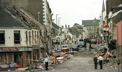 FILE - Royal Ulster Constabulary Police officers stand on Market Street, the scene of a car bombing in the centre of Omagh, Co Tyrone, 72 miles west of Belfast, Northern Ireland, on Aug. 15, 1998. (AP Photo/Paul McErlane, File) FILE - Royal Ulster Constabulary Police officers stand on Market Street, the scene of a car bombing in the centre of Omagh, Co Tyrone, 72 miles west of Belfast, Northern Ireland, on Aug. 15, 1998. (AP Photo/Paul McErlane, File)