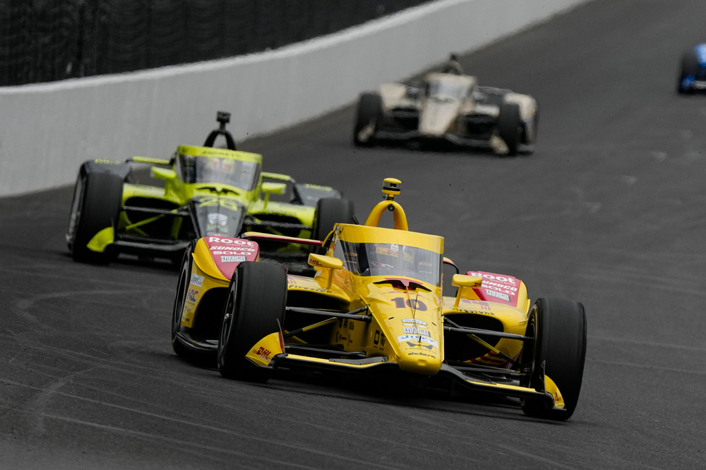 Alex Palou, of Spain, heads into the first turn during practice for the Indianapolis 500 auto race at the Indianapolis Motor Speedway in Indianapolis, Monday, May 18, 2026. (AP Photo/Michael Conroy)