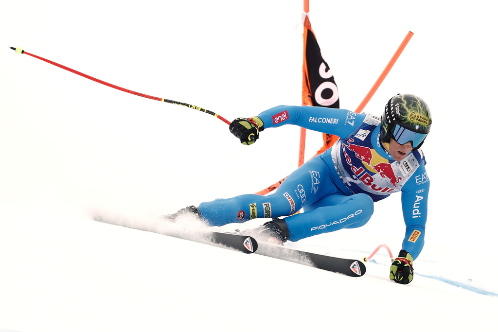 Italy's Giovanni Franzoni speeds down the course during a men's alpine ski World Cup downhill, in Kitzbuehel, Austria, Saturday, Jan. 24, 2026. (AP Photo/Gabriele Facciotti)