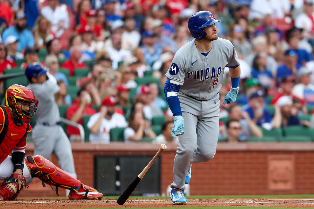 Chicago Cubs' Ian Happ, right, watches his three-run home run during the first inning against the St. Louis Cardinals, Friday, May 29, 2026, in St. Louis. (AP Photo/Scott Kane)